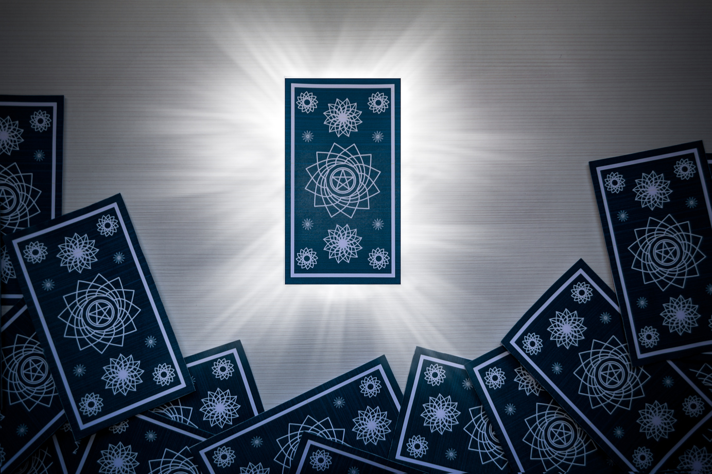 Blue Tarot Cards With One Glowing